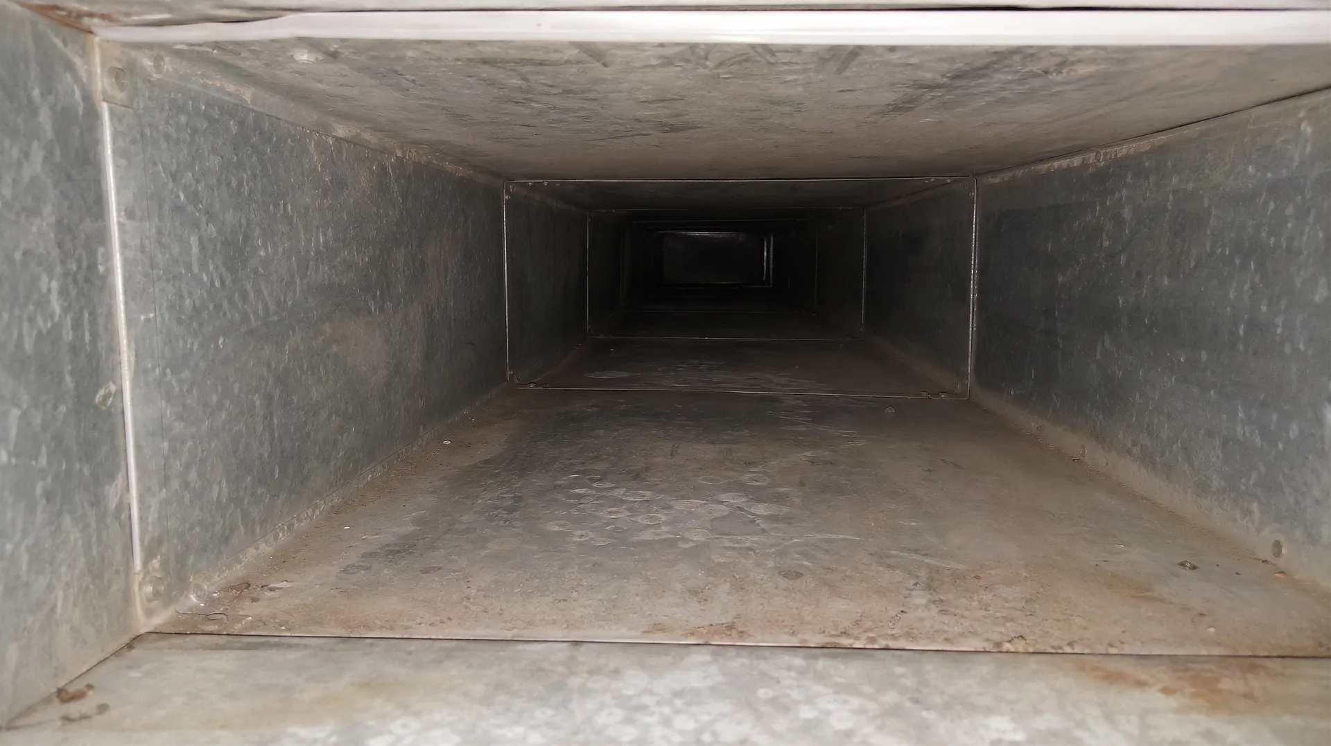 Dust-loaded duct interior before cleaning — DCC field photograph